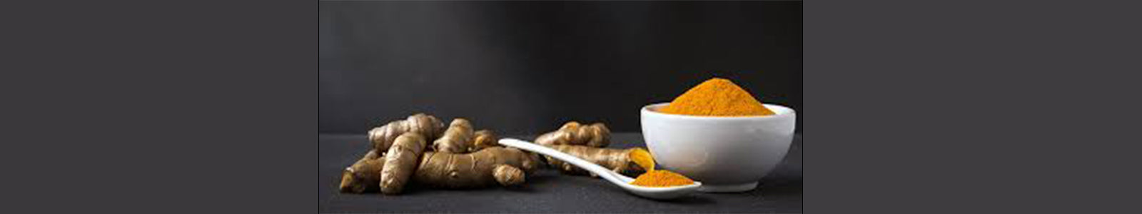 Woman applying turmeric face mask with a radiant, glowing complexion in a natural spa setting.