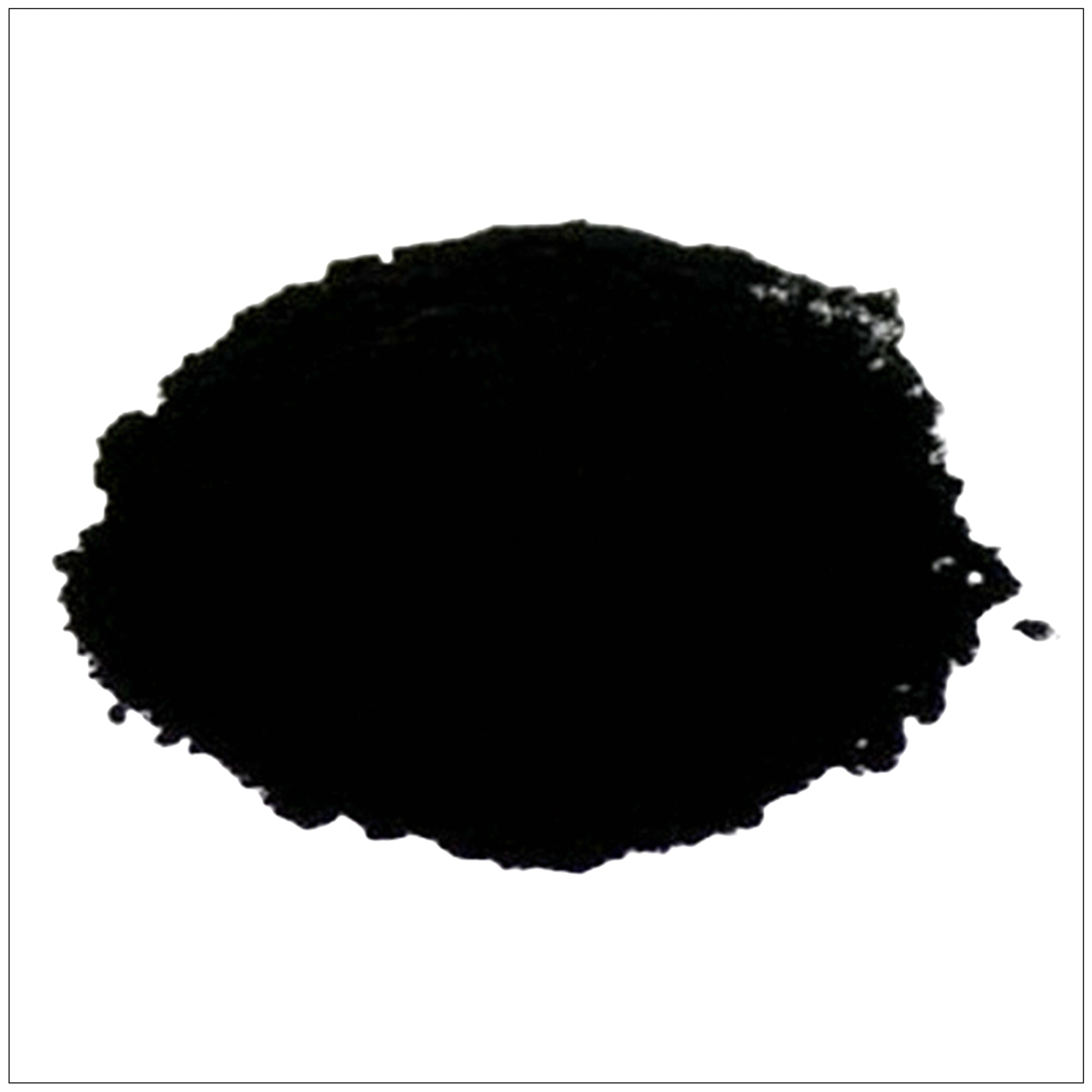 Activated charcoal powder in a spoon with capsules on a wooden table, used for detox and digestion support.