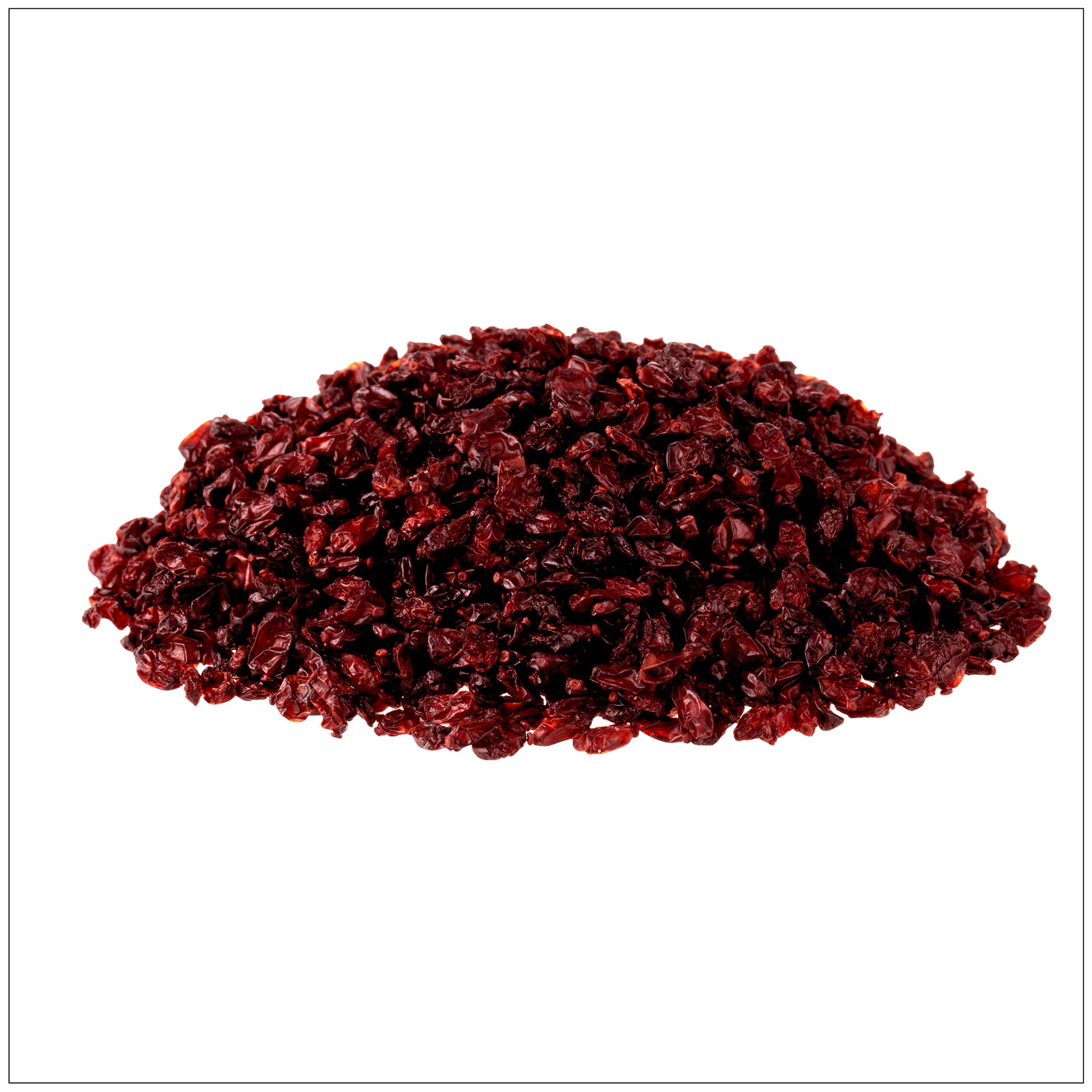 Close-up of dried barberries, small wrinkled red berries with a slightly glossy texture, scattered on a white background