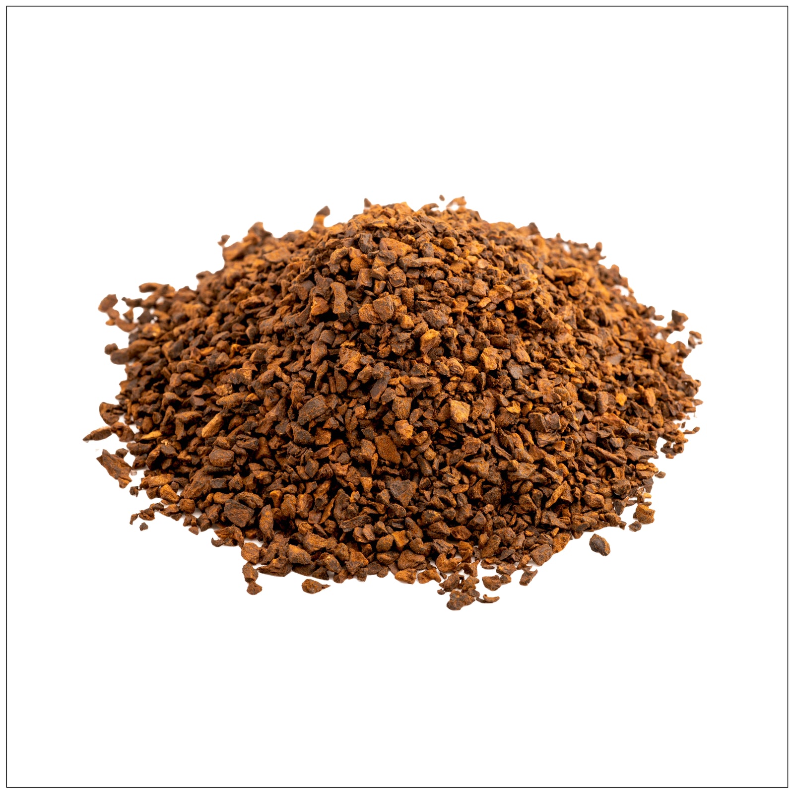 Roasted chicory root pieces with rich, coffee-like aroma on a rustic wooden surface.