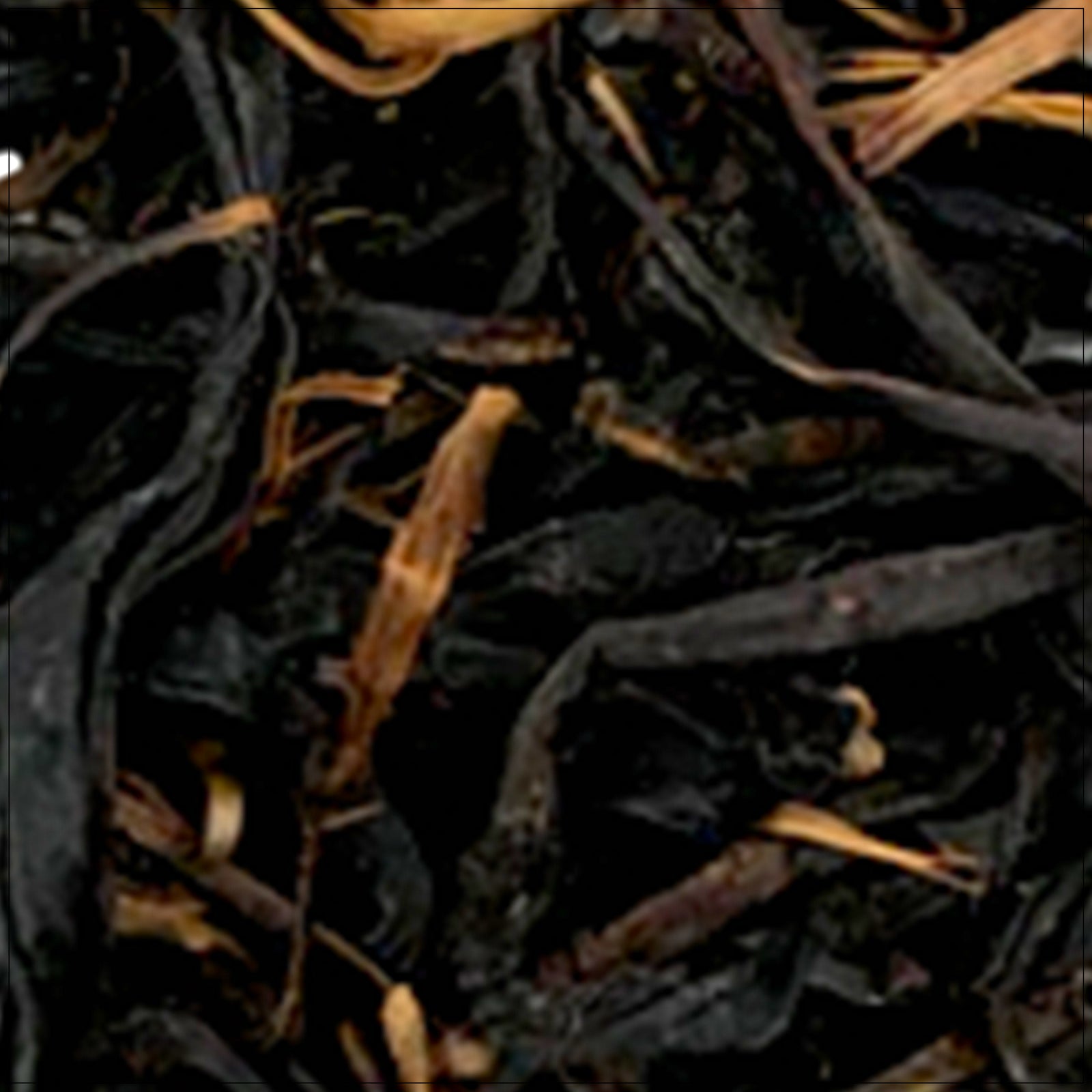 Loose-leaf High Mountain Black Tea in a porcelain cup with steam rising, showcasing rich amber color.