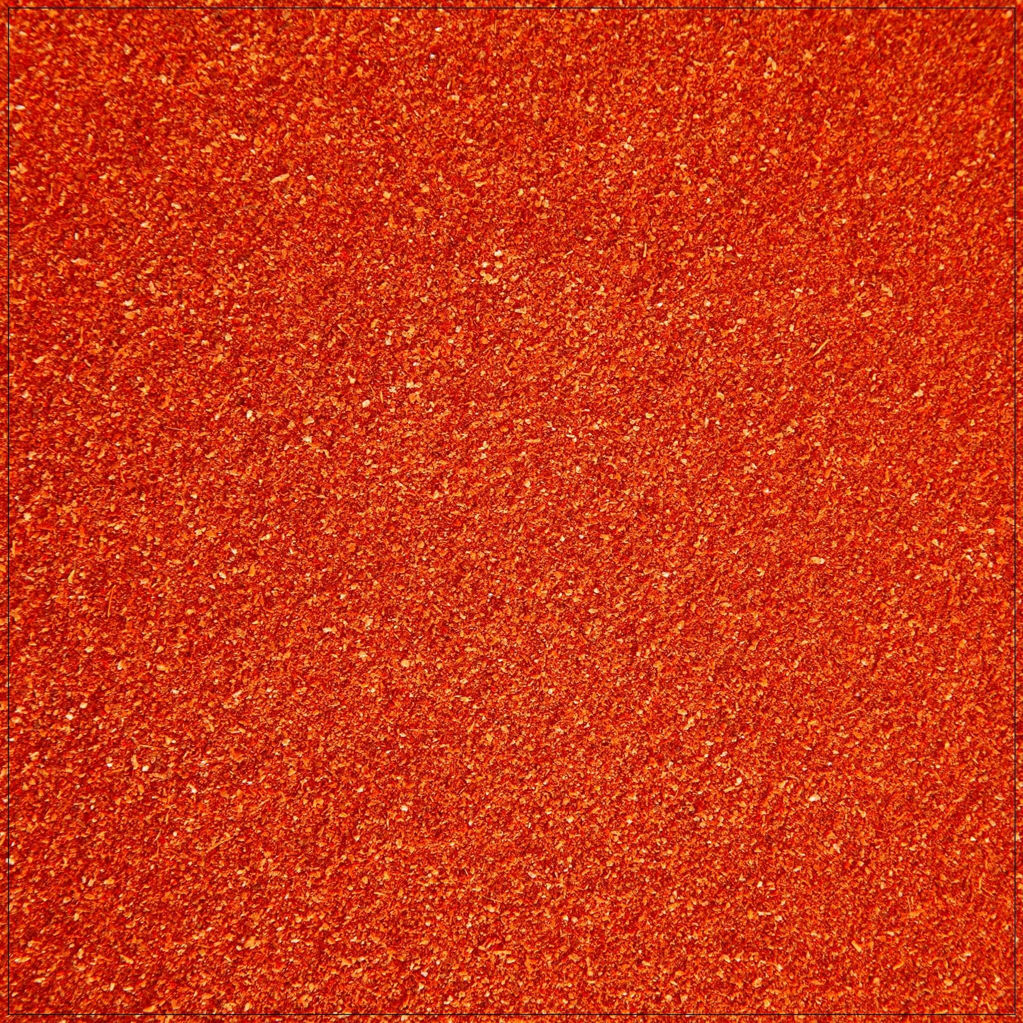 Premium hot chili powder made in the USA, perfect for adding spice to your dishes. Use for cooking, grilling, and enhancing flavors. Bold and fiery seasoning.