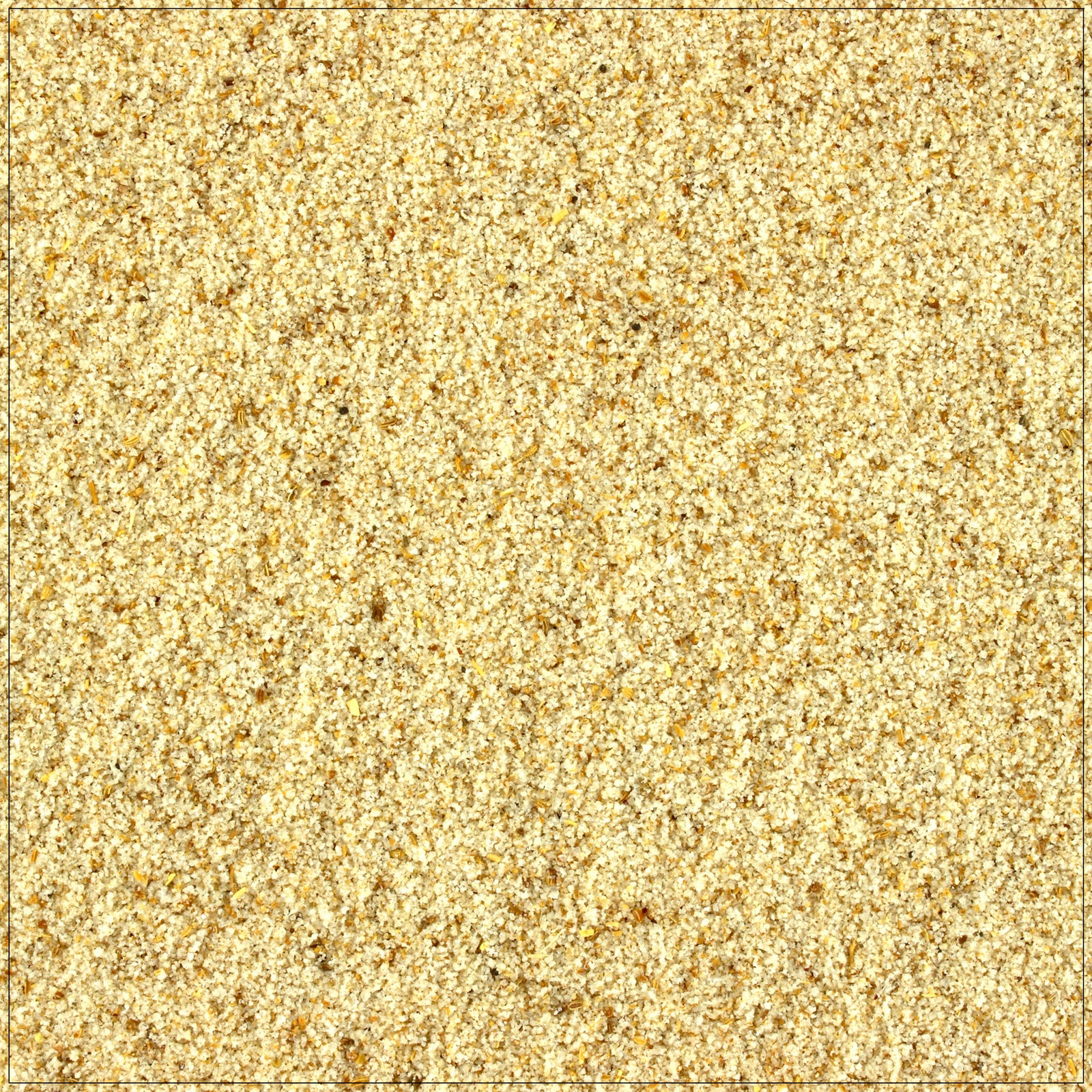 Close-up of finely ground celery salt in a wooden spoon on a rustic kitchen counter.