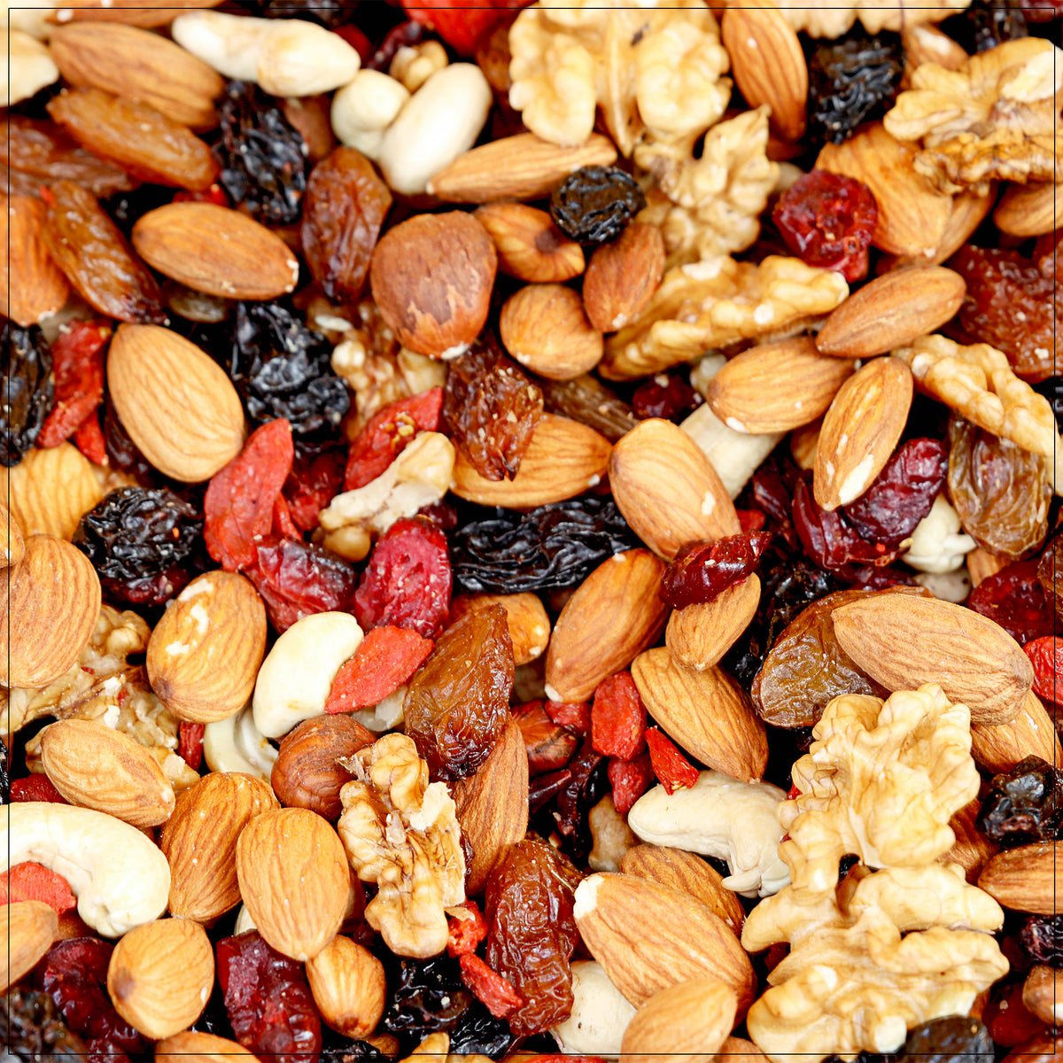 A mix of raw nuts, including almonds, cashews, walnuts, and hazelnuts.