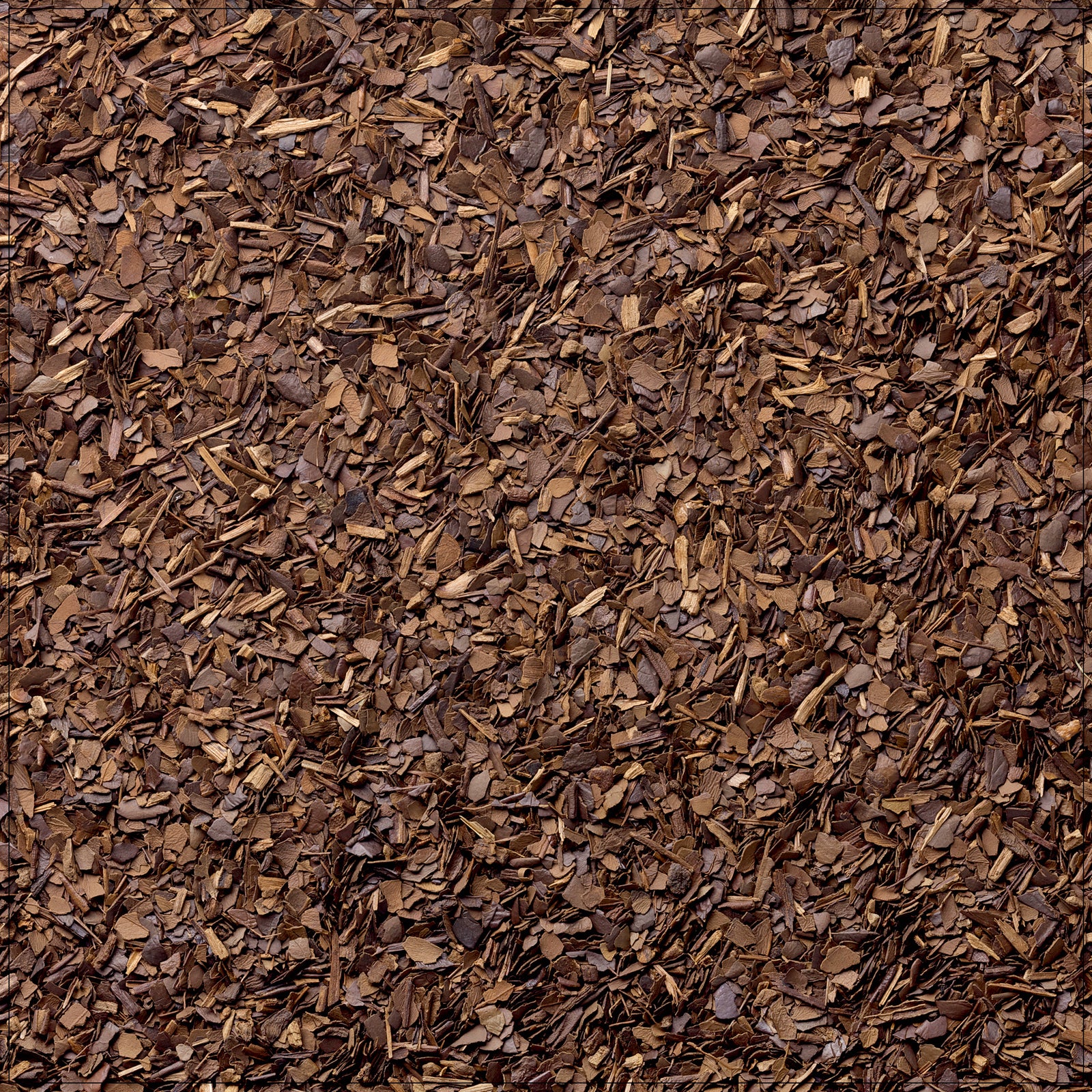 Cup of roasted yerba mate tea with dried leaves on a wooden table, rich aroma rising in warm light