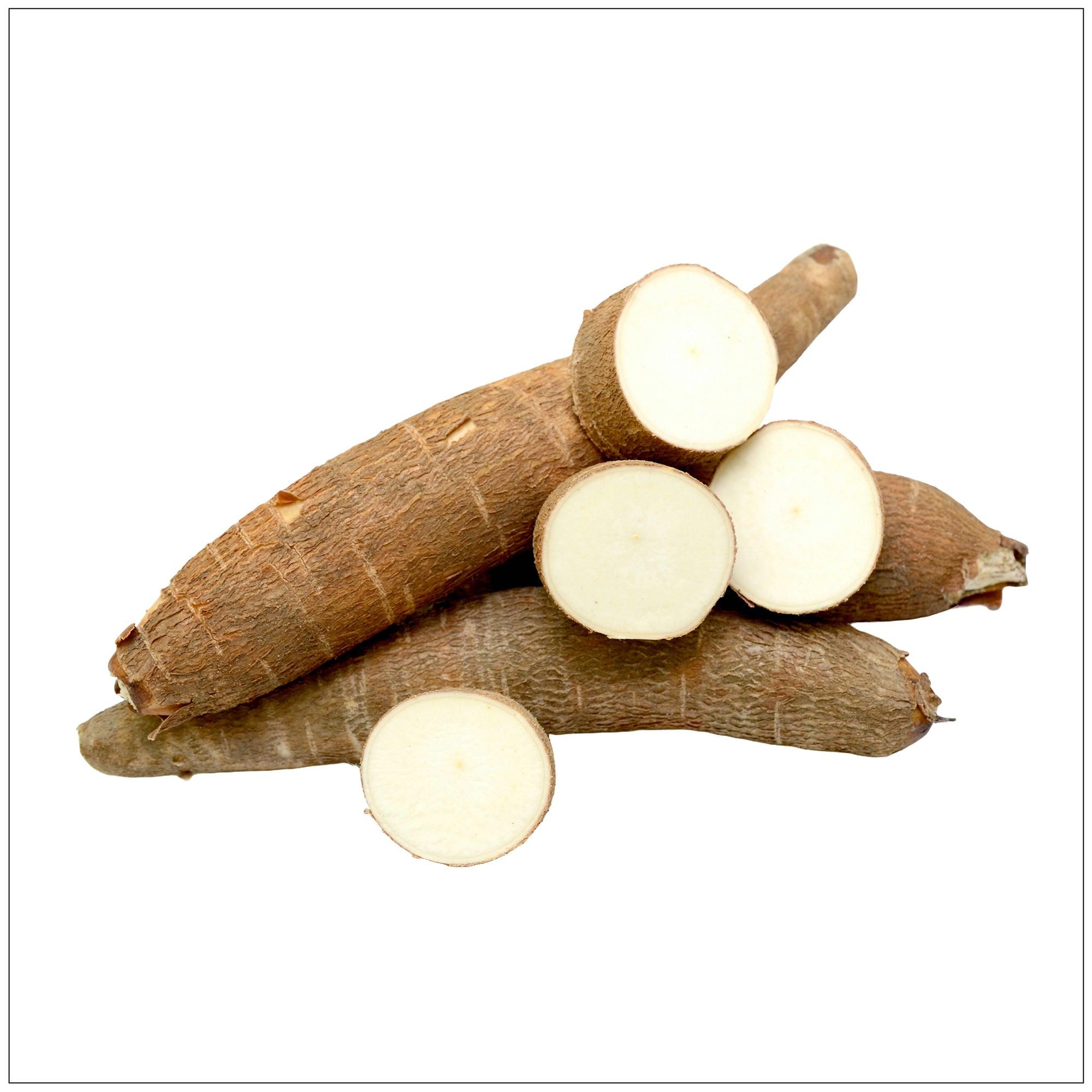 Fresh sliced yucca root on a wooden board, showing white starchy interior and rough brown skin.